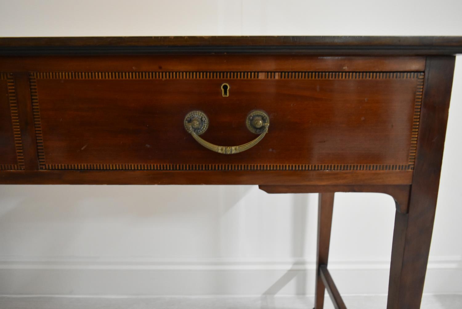 An Edwardian inlaid mahogany two drawer hall table raised on tapering supports terminating in pad - Image 9 of 14