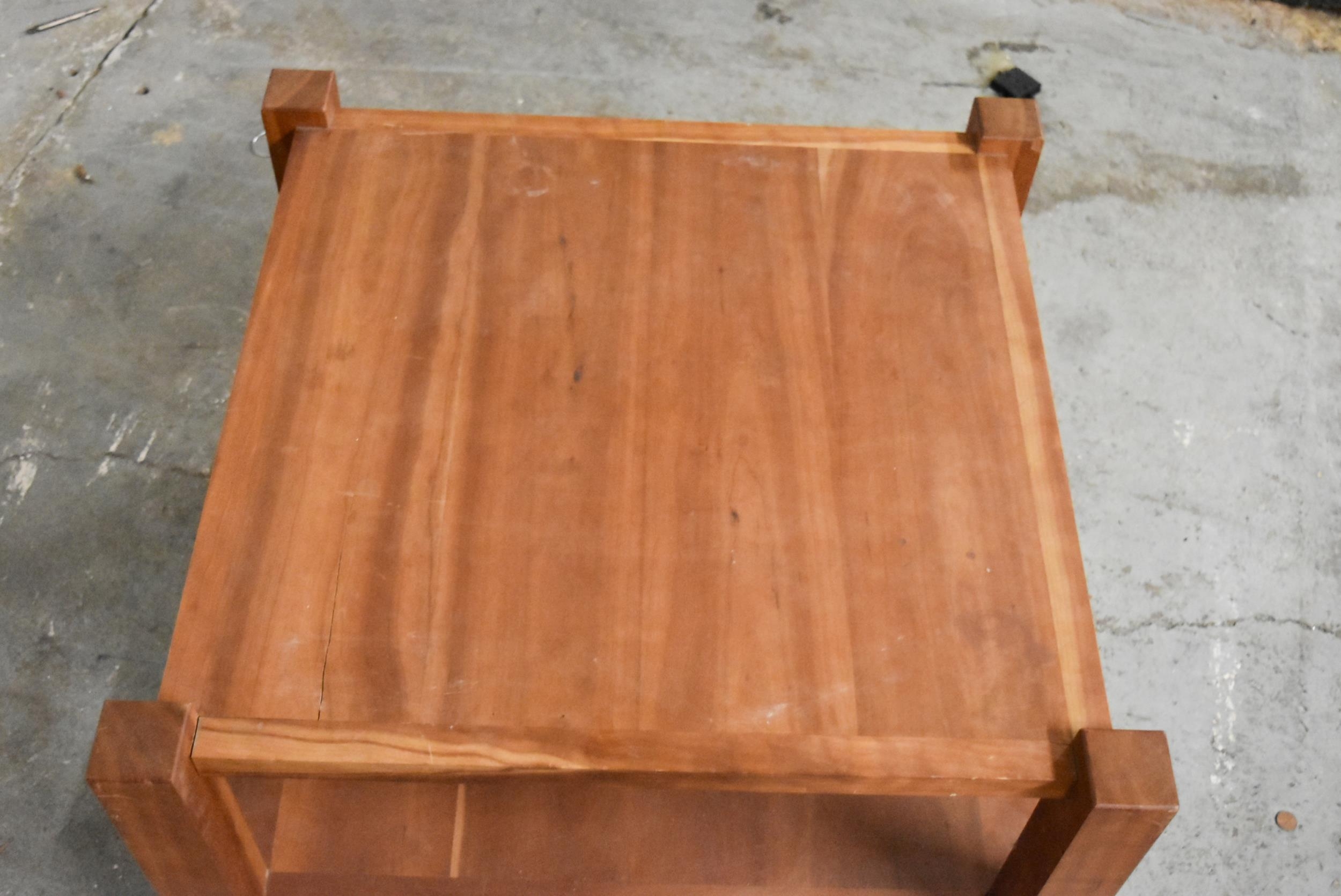 A contemporary hardwood low table on casters. H.48 x W.72 x D.72cm - Image 4 of 5
