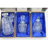 Three boxed Eric White studio glass purfume bottles and stoppers. Tallest H.11.5cm