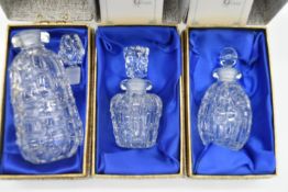 Three boxed Eric White studio glass purfume bottles and stoppers. Tallest H.11.5cm