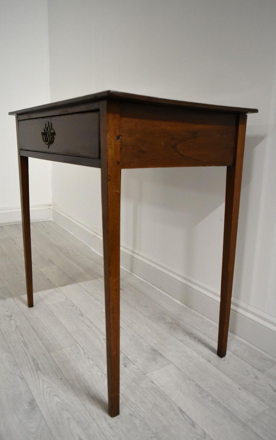 An Edwardian mahogany single drawer hall table raised on square tapering supports. H.76 W.77.5 D. - Image 3 of 7