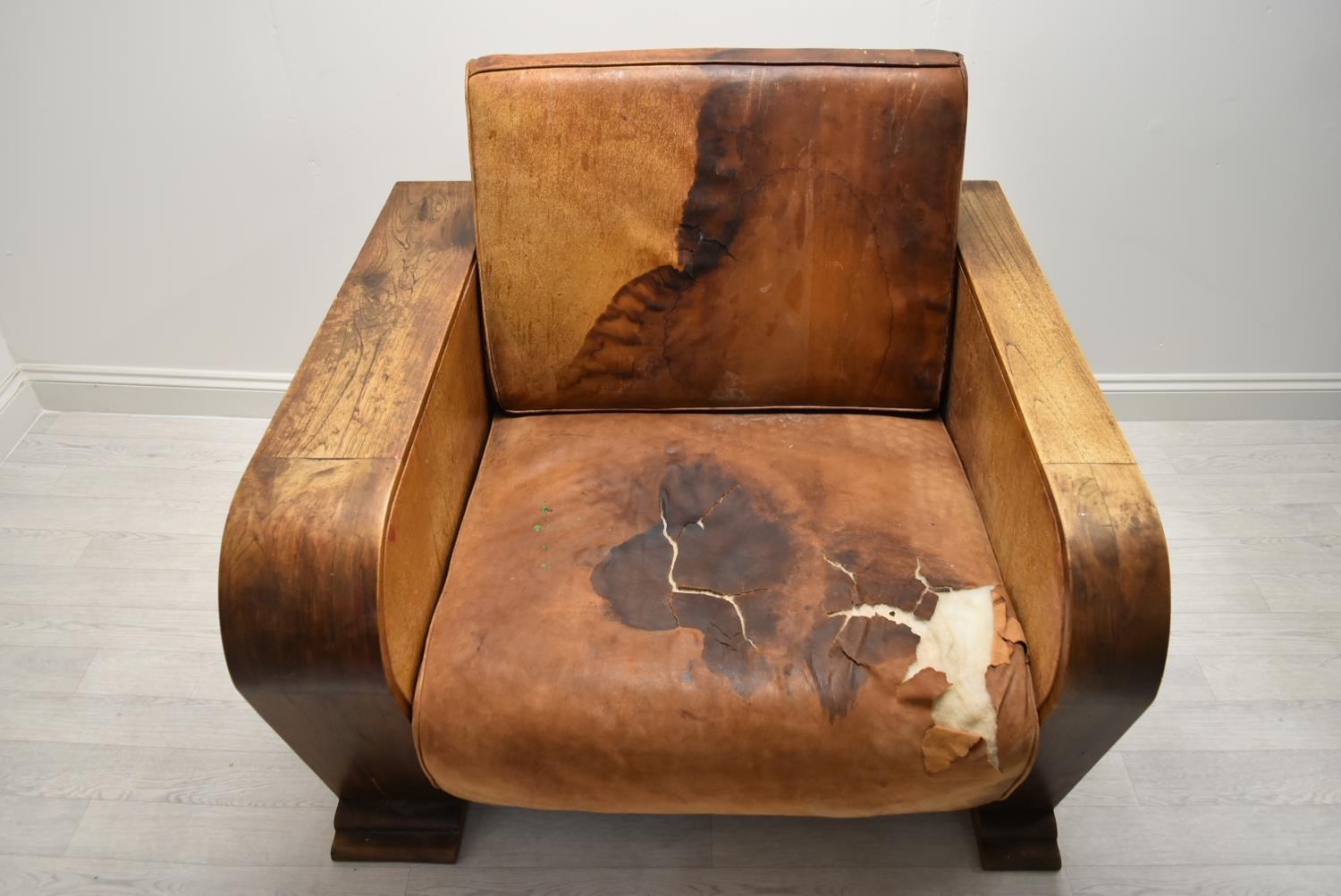 A walnut framed Art Deco leather armchair, the arms and back with integrated shelves. H.86.5 W.111.5 - Image 3 of 7