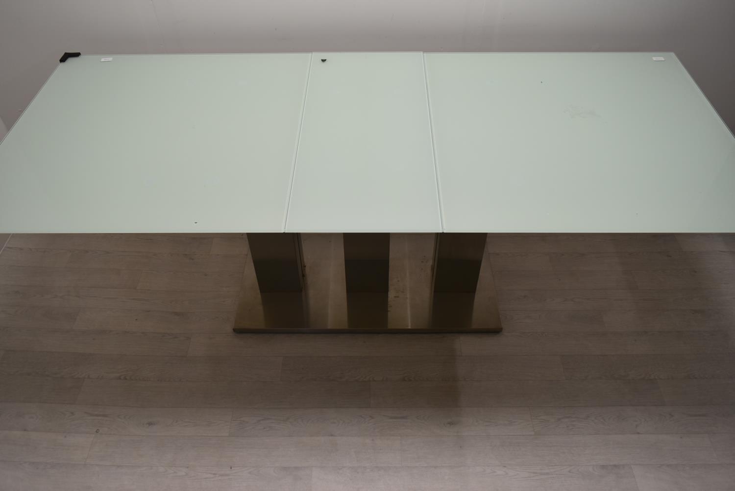 A contemporary extending glass dining table on brushed metal base. H.76 W.221 D.90cm - Image 2 of 21
