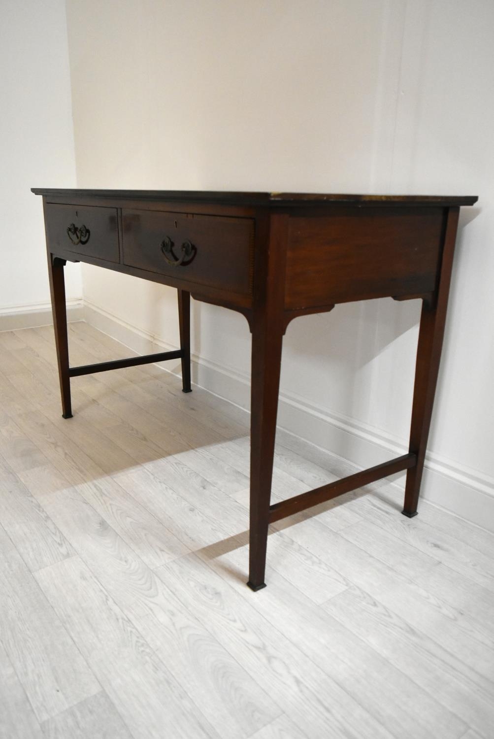 An Edwardian inlaid mahogany two drawer hall table raised on tapering supports terminating in pad - Image 4 of 14