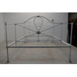 A Victorian style painted metal single bed complete with side irons. H.117.5 W.137 D.198.5cm