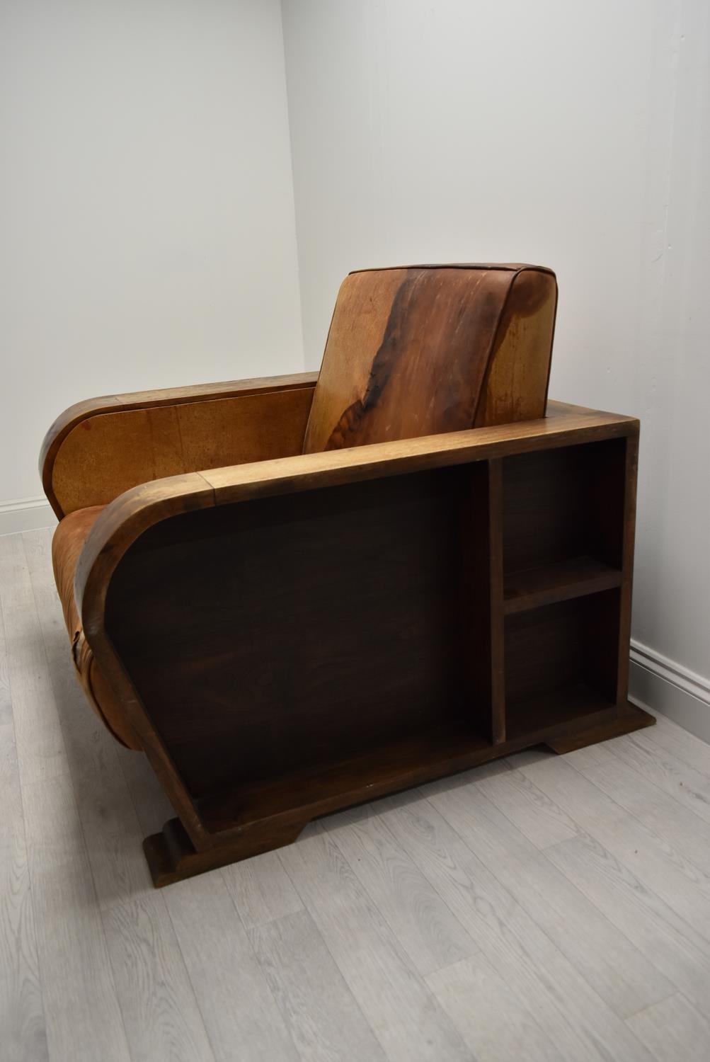 A walnut framed Art Deco leather armchair, the arms and back with integrated shelves. H.86.5 W.111.5 - Image 5 of 7