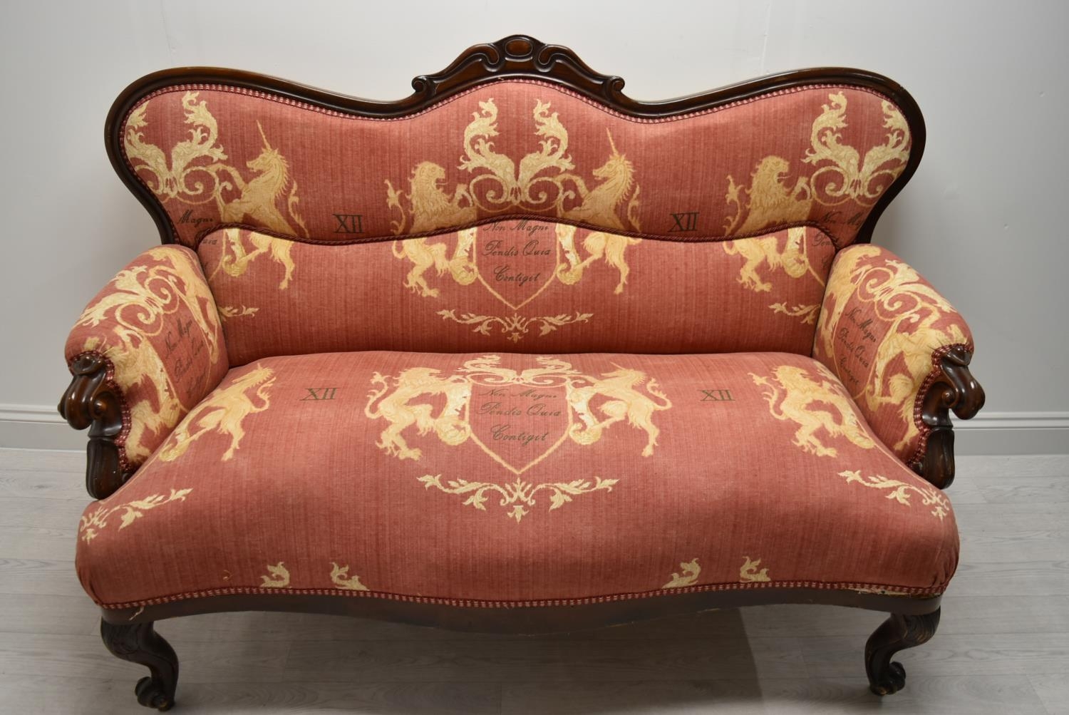 A late 19th / early 20th century mahogany framed French style settee with scroll arms raised on - Image 2 of 5