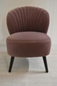 A contemporary shell back upholstered chair upholstered in purple velvet velour fabric raised on