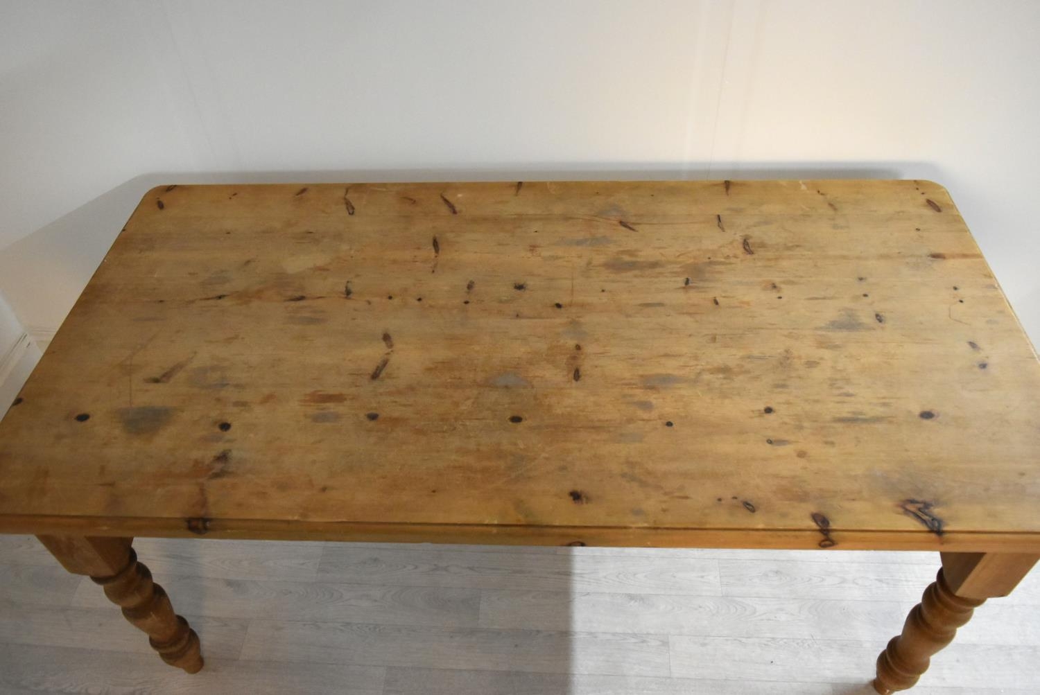 A rectangular pine farmhouse style kitchen table raised on turned supports. H.77 W.183 D.92cm - Image 2 of 6