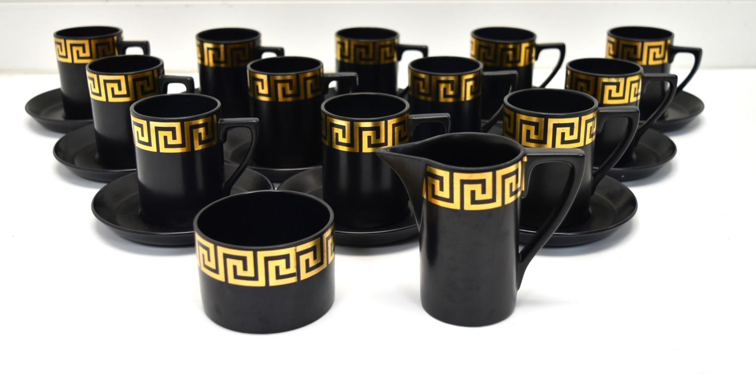 A 20th century Portmeirion twelve person part coffee set decorated with gilt painted Greek Key