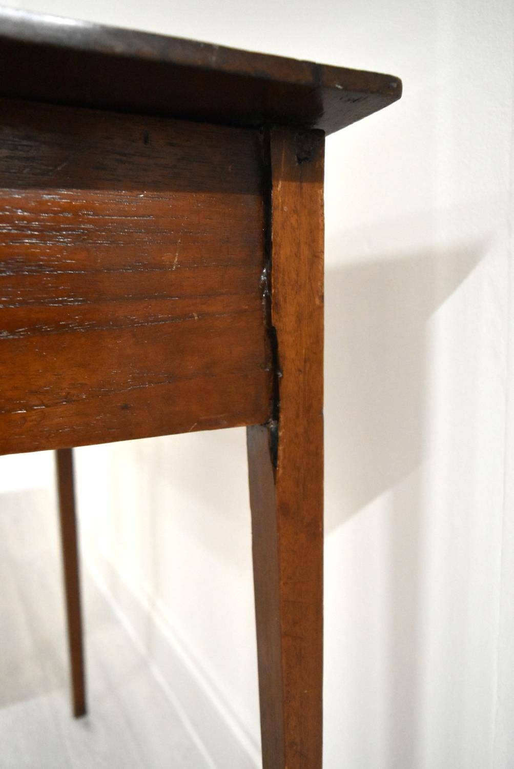 An Edwardian mahogany single drawer hall table raised on square tapering supports. H.76 W.77.5 D. - Image 5 of 7