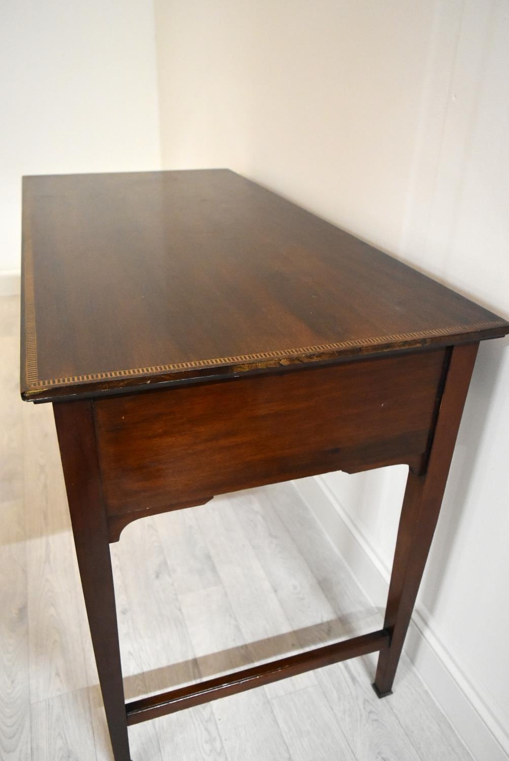 An Edwardian inlaid mahogany two drawer hall table raised on tapering supports terminating in pad - Image 14 of 14