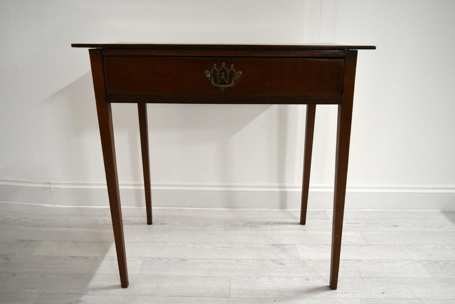 An Edwardian mahogany single drawer hall table raised on square tapering supports. H.76 W.77.5 D.