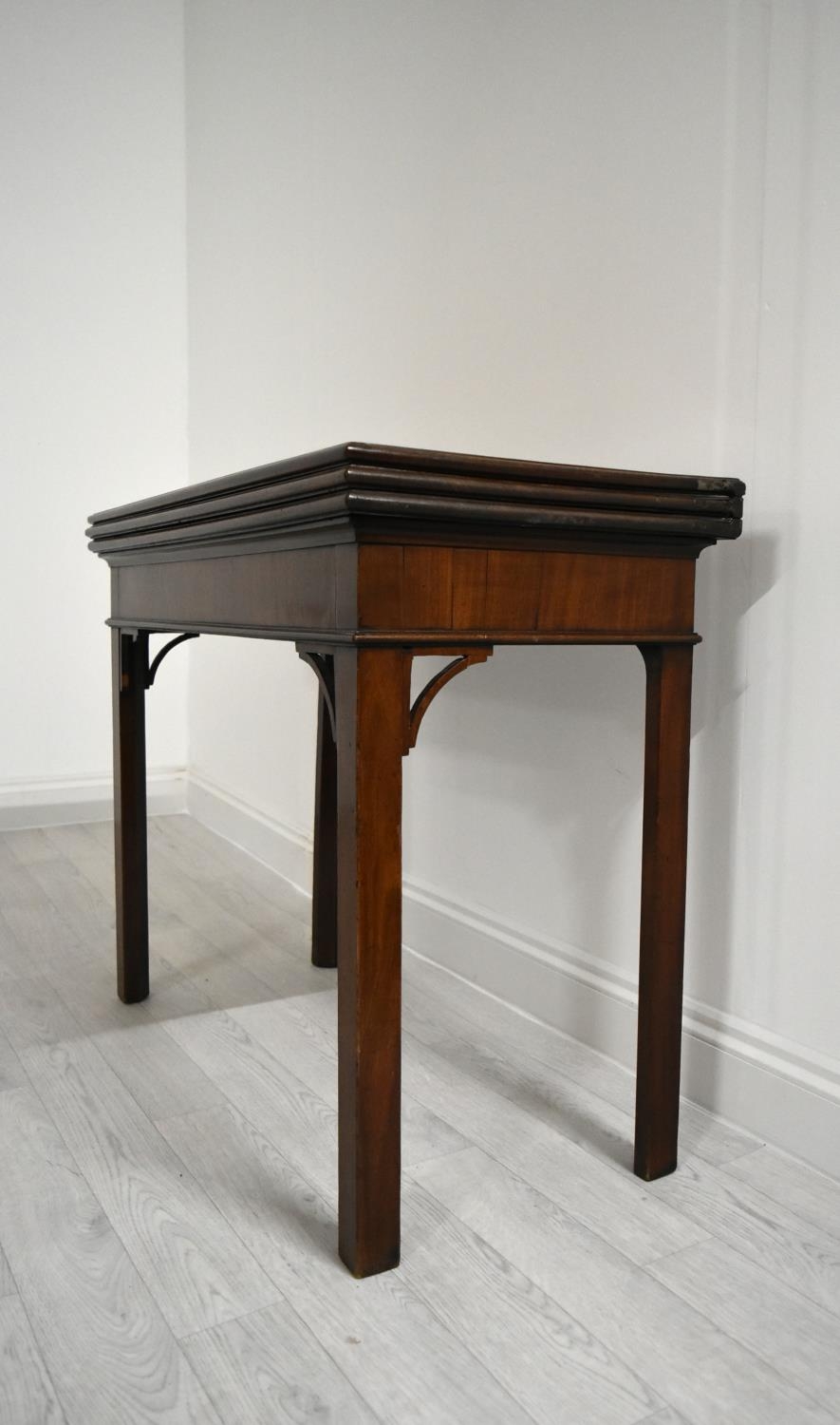 A George III mahogany rectangular fold over table raised on square supports. H.75.5 W.92.5 D.45. - Image 2 of 11