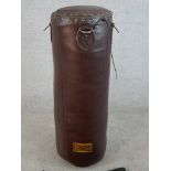 A brown leather boxers punch bag made by Seletti Boxitalia. Complete with its carrying bag. H.85 W.