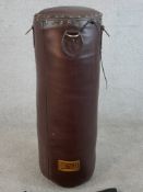 A brown leather boxers punch bag made by Seletti Boxitalia. Complete with its carrying bag. H.85 W.