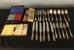 A collection of mixed cutlery including a set of spoons. The largest measuring 20cm.
