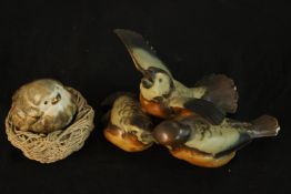Two 20th century Danish Bing & Grondahl painted stoneware bird groups, marks to base. H.8cm (