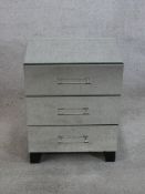 A contemporary mirrored three drawer bedside chest of three drawers raised on shaped bracket feet.