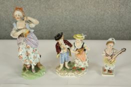 A late 19th/early 20th century painted Dresden porcelain figure of two musicians, painted and