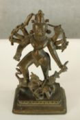 Indian bronze statue of the god Durga slaying the buffalo demon. H.20cm.