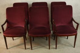 A set of six mid 20th century mahogany framed red upholstered dining chairs raised on tapering
