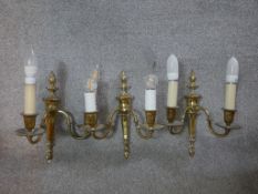 Three twin branch brass wall lights. H.40 x W.28 D.20 cm.