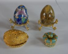 A 20th century Japanese cloisonne egg shaped ornament together with a gilt metal and a hardstone egg