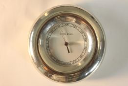 A contemporary Georg Jensen chrome plated circular air pressure gauge. H.16 W.15cm.
