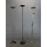 Three contemporary floor standing electric uplighters, one with adjustable reading light. H.187 W.26