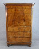 A 19th century Biedermeier style walnut secretaire bureau, the fall front opening to fitted interior