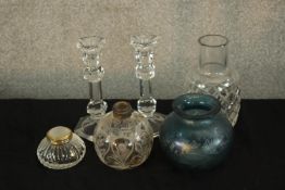 A pair of 20th century glass candlesticks, together with a iridescent glass vase, a glass grenade