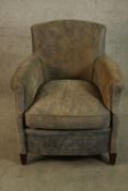 A contemporary mahogany framed grey upholstered tub style armchair raised on tapering supports. H.73