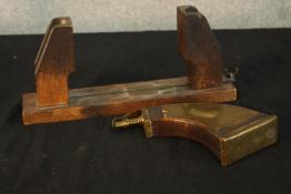 A 19th century mahogany table top hat stretcher, together with a 19th century brass and mahogany