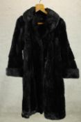 A 20th century ladies B.C. Winterson black fur ladies full length ladies coat. L.116cm.