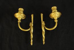 A pair of 20th century cast brass single candle wall sconces. H.22cm. (each)