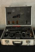 A cased Canon FT QL camera with lenses and accessories. H.16 x W.46 x D.35cm.