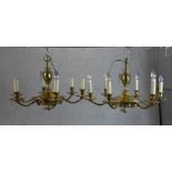 A pair of 19th century French gilded brass six branch chandeliers. H.47 W.71 D.71cm