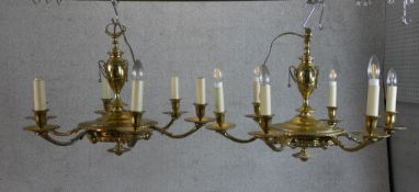 A pair of 19th century French gilded brass six branch chandeliers. H.47 W.71 D.71cm