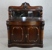 A mid Victorian mahogany mirror backed chiffonier with single drawer and twin cupboard doors