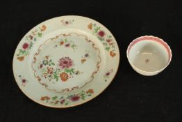 A 19th century Chinese Export porcelain plate decorated with flowers, together with a 19th century