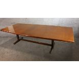 A mid century teak extending boardroom table with extra leaf on trestle supports. H.75 L.245 W.106cm