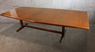 A mid century teak extending boardroom table with extra leaf on trestle supports. H.75 L.245 W.106cm