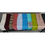 Ten assorted vintage plain and patterned cotton scarves.