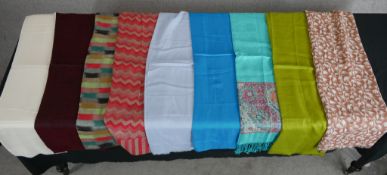 Ten assorted vintage plain and patterned cotton scarves.