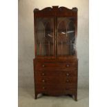 An early Victorian mahogany W. Priest of Blackfriars glazed secretaire bookcase, the upper section