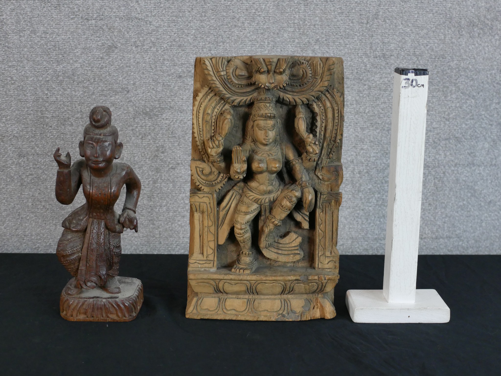 A 20th century Indian hardwood panel carved with a godess together with a carved Balinese hardwood - Image 2 of 2