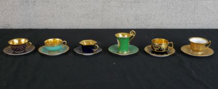 Six 20th century richly gilt painted porcelain cabinet cups and saucers. H.9 W.11 D.11cm largest