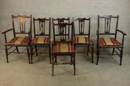 A set of six mahogany framed chairs comprised of two open arm carvers and four singles, each with