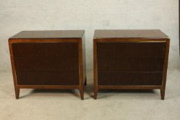 A pair of contemporary hardwood three long drawer chest of drawers, each with fluted fronts raised
